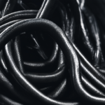 Should a separate hose be used for flushing black tanks? - Image of a technician wearing protective gear while inspecting a water storage tank in Dubai.