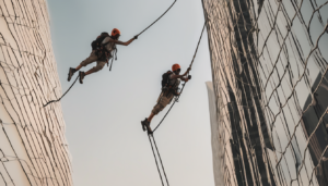 Rope Access Cleaning Certification Requirements UAE - technician performing certified facade maintenance on Dubai high-rise building